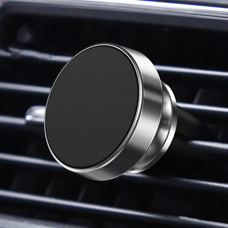 Magnetic car phone holder with aluminium alloy cradle shown in black, mounted on a car air vent.