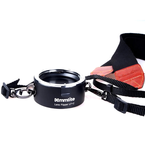 Aluminium alloy Nikon E-Mount lens flipper with stainless steel buckle and cotton shoulder strap.