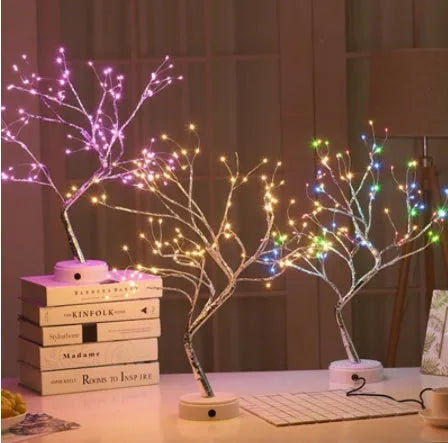 White LED Christmas tree shaped night light with touch base, standing 50cm tall on a table.
