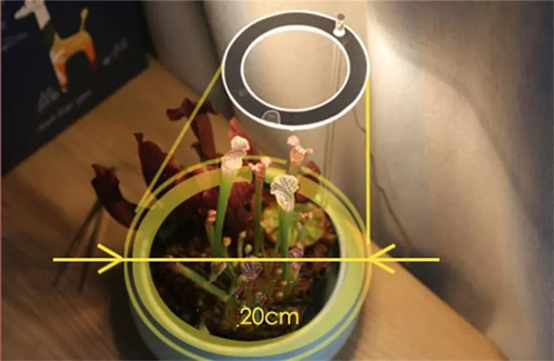 USB-powered LED plant grow light with full spectrum yellow LEDs, acrylic mounting stick, in pink/white colour.