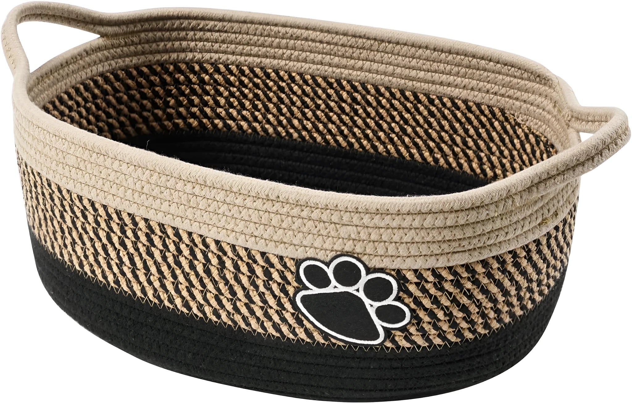 Light beige handmade woven cotton rope storage basket with a handle on a wooden surface.