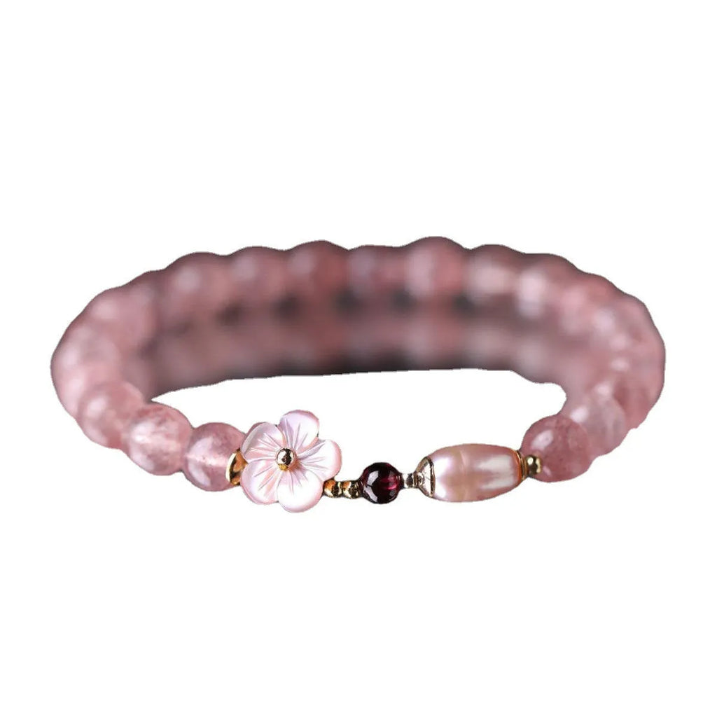 Women's casual crystal bracelet with a strawberry quartz peach blossom flower charm.
