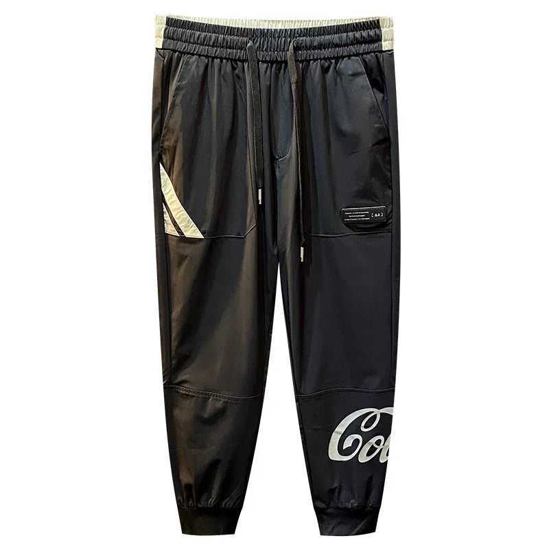 Black men's cropped trousers with elasticated ankle band in ultra-thin ice silk fabric