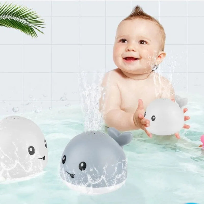 Electric induction whale bath spray toy with automatic water sensor and coloured LED lights floating in water