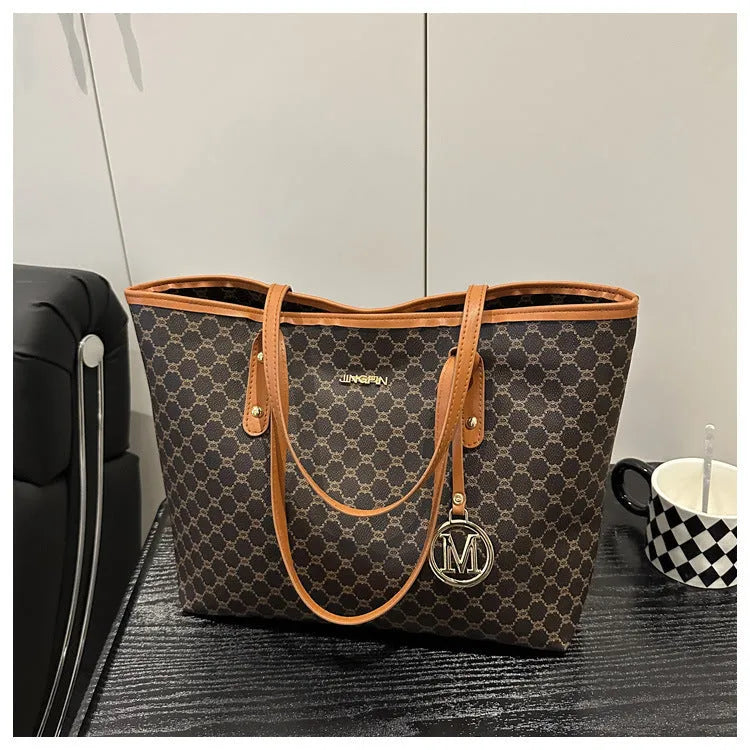 PU leather street trend shoulder bag with sewing thread detail in a choice of colours.