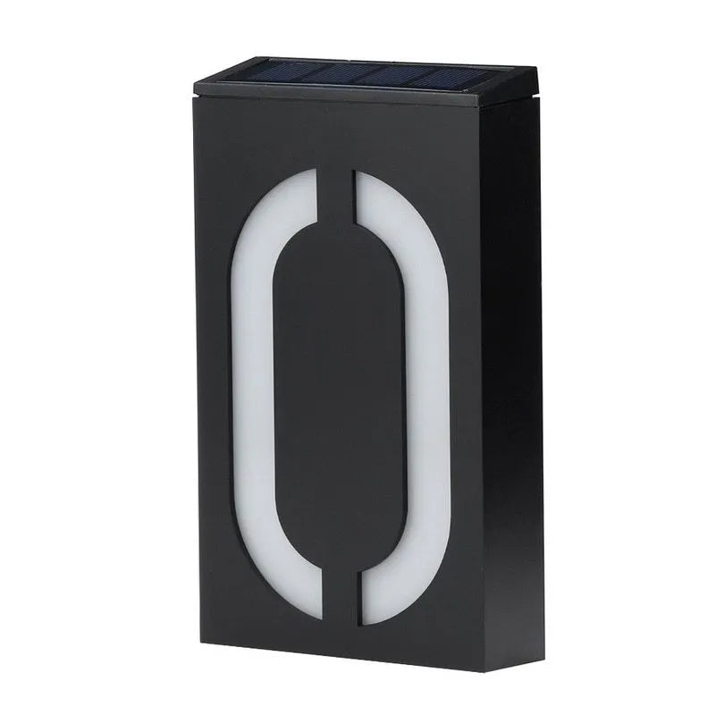 Solar-powered white LED house number light mounted on an outdoor wall