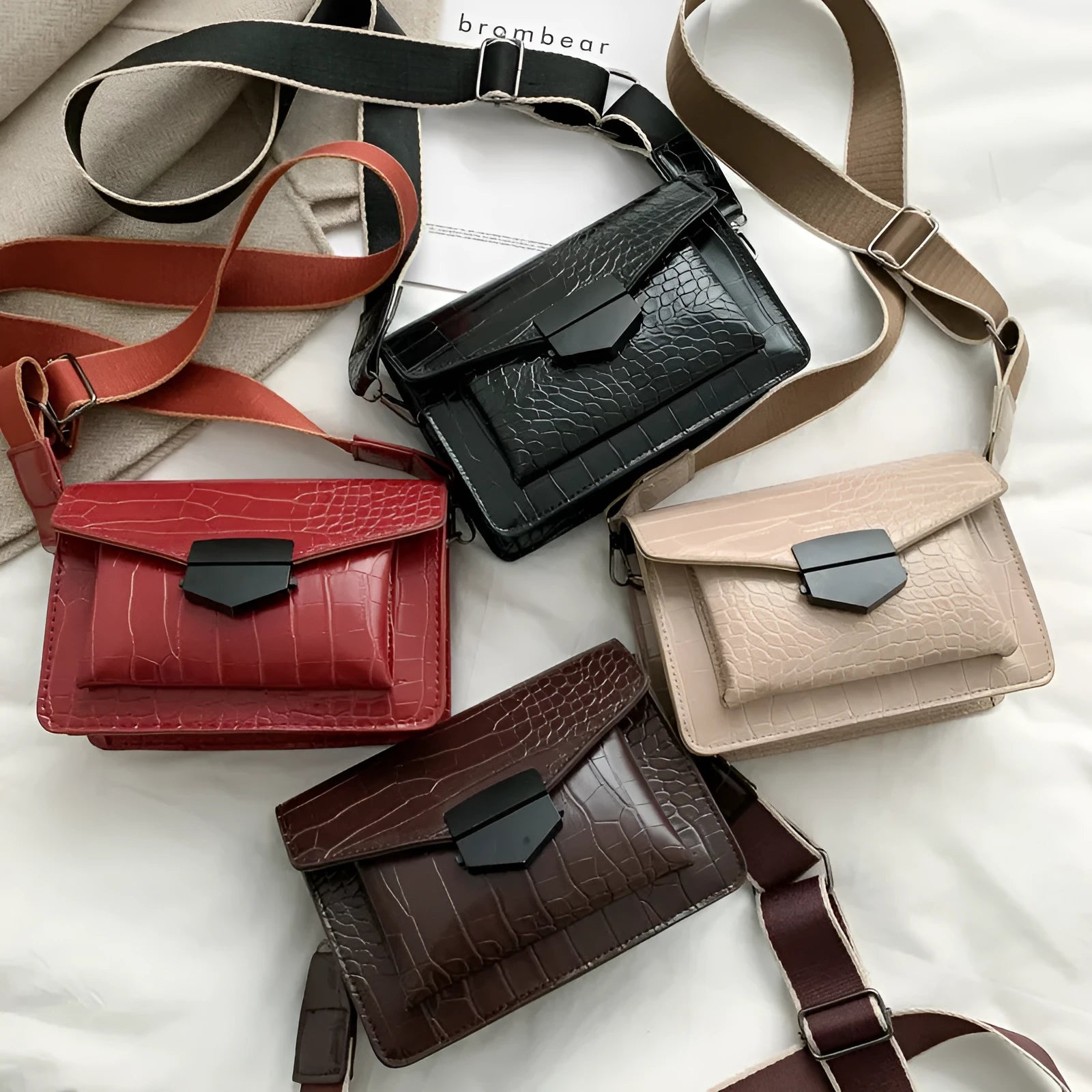 Vintage PU crossbody bag in black, shown with adjustable strap and open to reveal polyester lining.