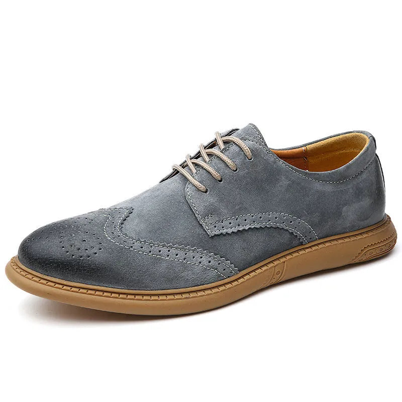 Men's black genuine cowhide leather lace-up business shoes with rubber sole on a grey background.