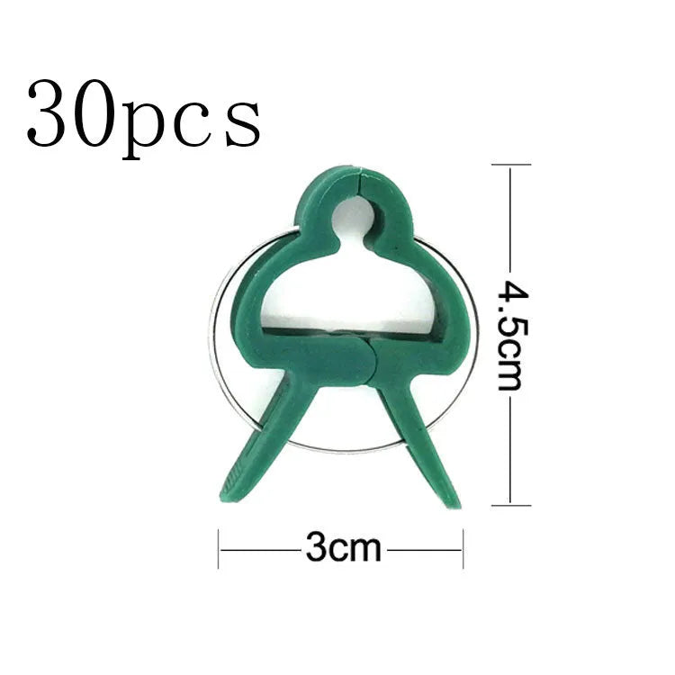 Green plastic and zinc plant fixing clips for large and small climbing plants like tomatoes and beans.