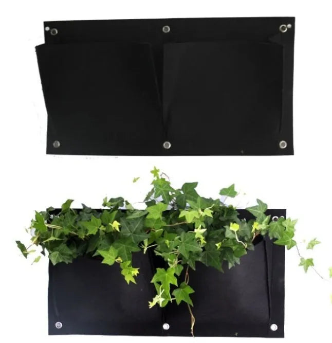 Green recycled felt vertical wall planter with multiple planting pockets hung on a wooden fence.