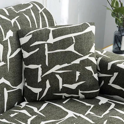 Printed stretch sofa cover with geometric pattern on three-seater sofa