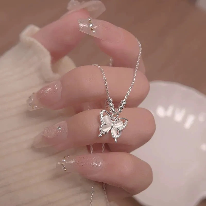 Women's sterling silver butterfly necklace with cross chain design on adjustable 41-50cm perimeter