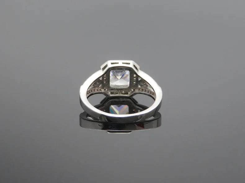 Women's platinum-coloured hollow geometric ring with quadrilateral ornament design and inlaid zircon stones