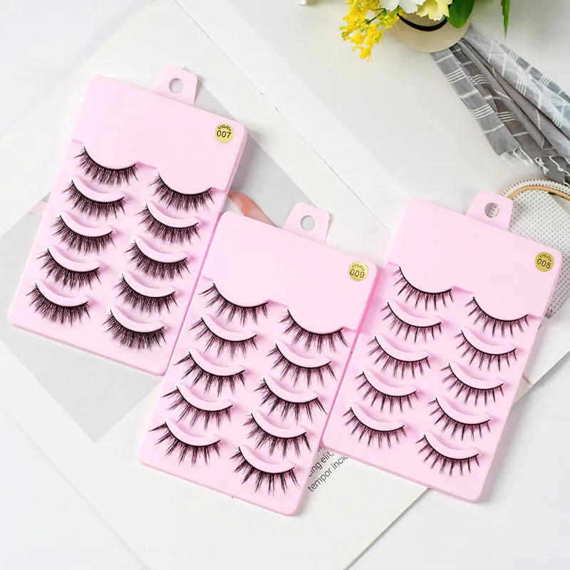 Five pairs of natural wispy false eyelashes on a card for manga anime cosplay and Korean style makeup.