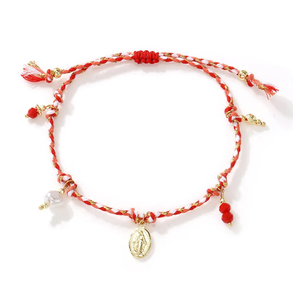 Close-up of a hand-woven colourful braided rope bracelet with an adjustable strap tag closure.
