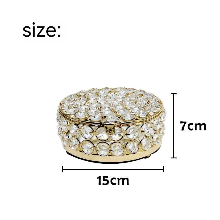 French gold metal jewellery box with a transparent crystal glass lid for storing rings and necklaces.