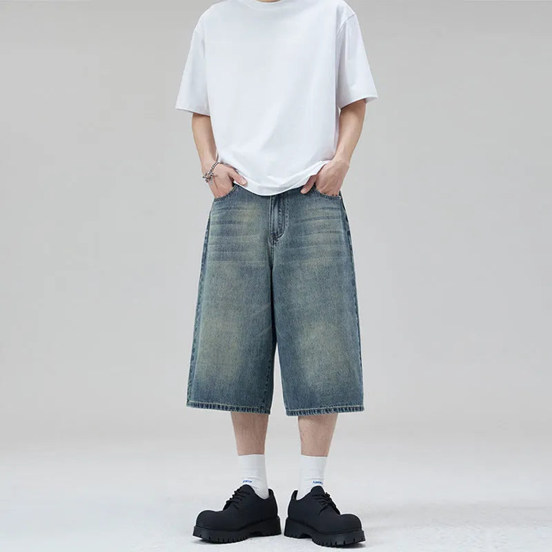 Men's light blue denim shorts with a straight leg and cropped length on a mannequin.