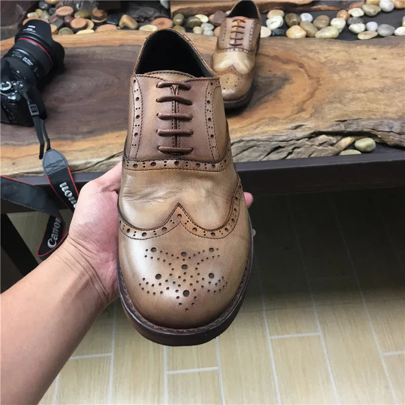Light brown men's vintage distressed leather shoes with engraved detailing and lace-up closure