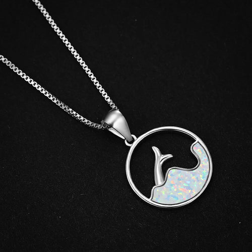 Geometric fishtail pendant necklace with a round blue opal stone on an adjustable silver-tone chain.