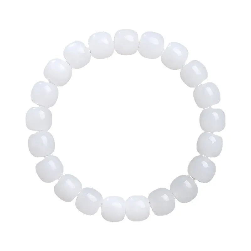White Hetian jade barrel bead bracelet for men and women on a wrist, showing three bead size options.