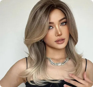 Mid-length platinum gradient colour wig with curly hair and fringe on model