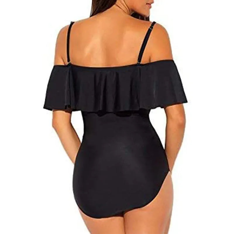 Black one-piece swimsuit with cut-out design and ruffled strap tube top