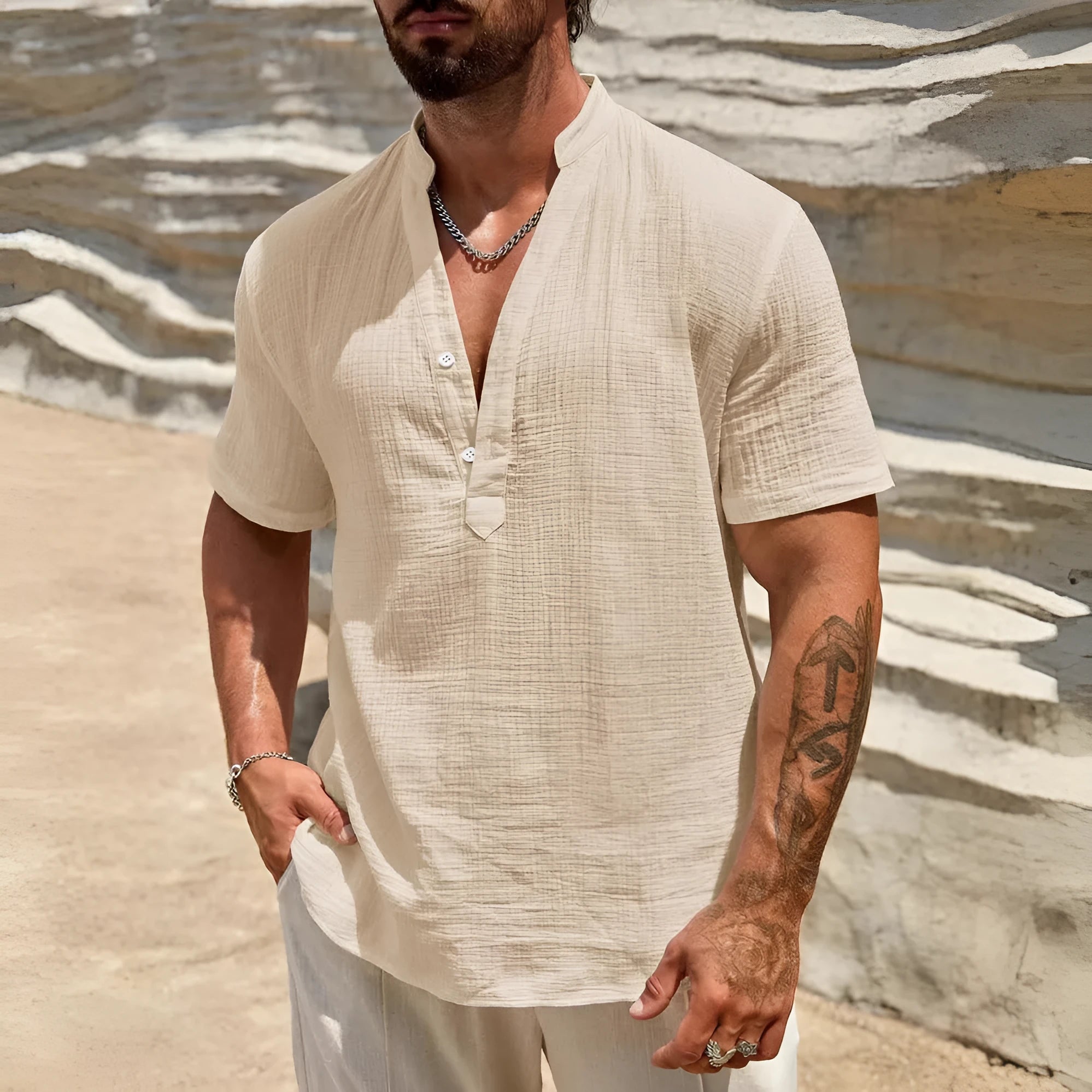 Men's solid colour stand collar short-sleeved casual shirt laid flat, showing slit detail and thin fabric.