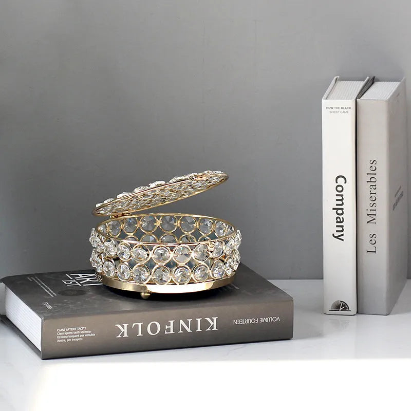 French gold metal jewellery box with a transparent crystal glass lid for storing rings and necklaces.