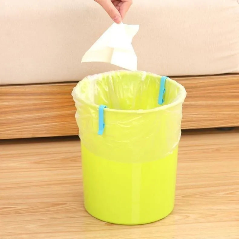 A white PP plastic clip designed to secure a bin bag to the side of a kitchen rubbish bin.