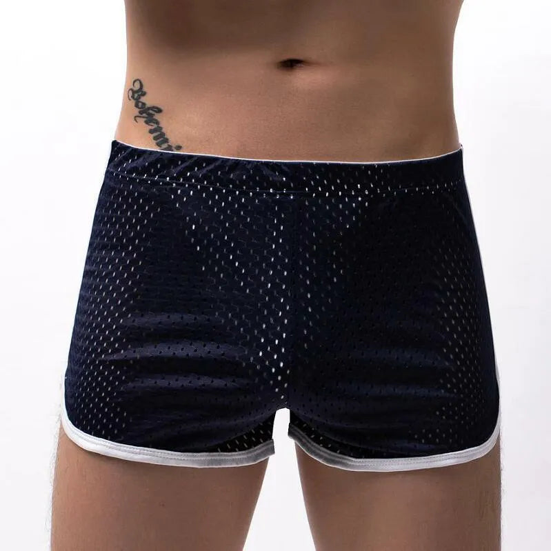 Men's black boxer shorts showing three-point ventilation panels and a mid-waist design.