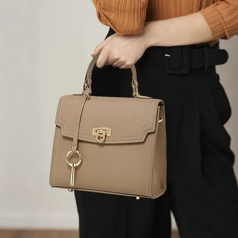 Elephant grey vintage lock handbag in genuine leather with three-dimensional pockets