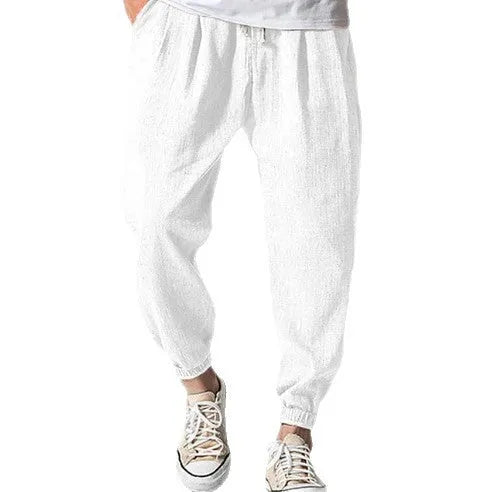 Men's loose cotton summer trousers with banded ankle cuff in light green colour