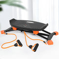 Black mini fitness skiing machine for home indoor exercise with elastic hand straps.