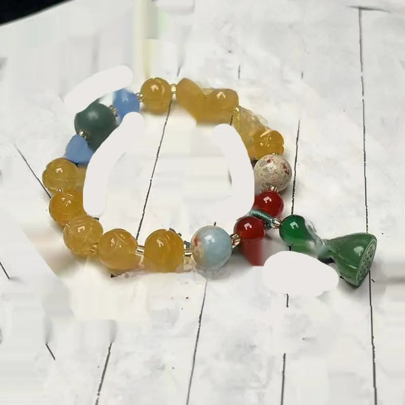 Carved pumpkin lotus bodhi root bracelet with white jade segments and golden silk jade treasures