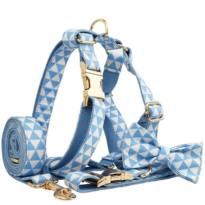 Blue cloth dog accessory set showing vest, collar, leash, and bow for small to medium breeds