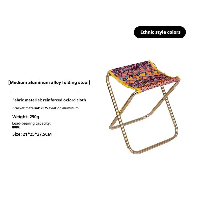 Black aluminium alloy folding stool in collapsed position for camping and outdoor use
