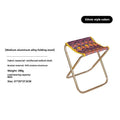 Black aluminium alloy folding stool in collapsed position for camping and outdoor use
