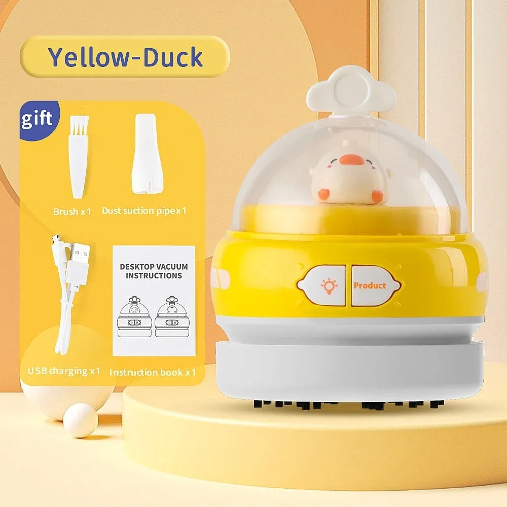 Blue handheld USB desktop vacuum cleaner on a wooden desk next to a keyboard.