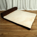 Corduroy dog bed sofa with bolster sides and non-slip base in a neutral colour.