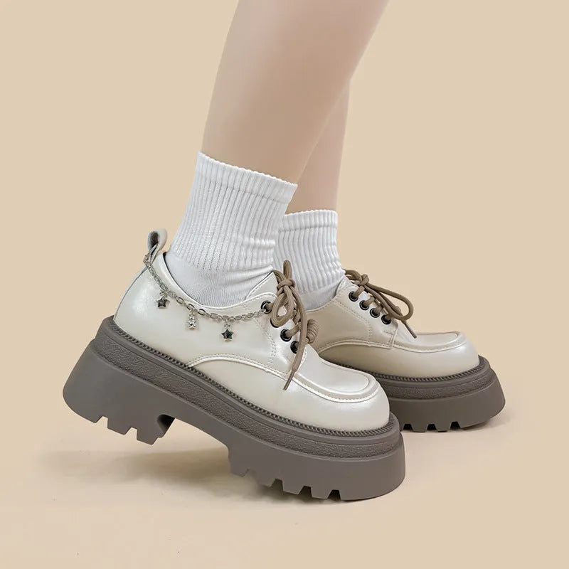 White Mary Jane platform shoes with chunky heel and front lace-up fastening