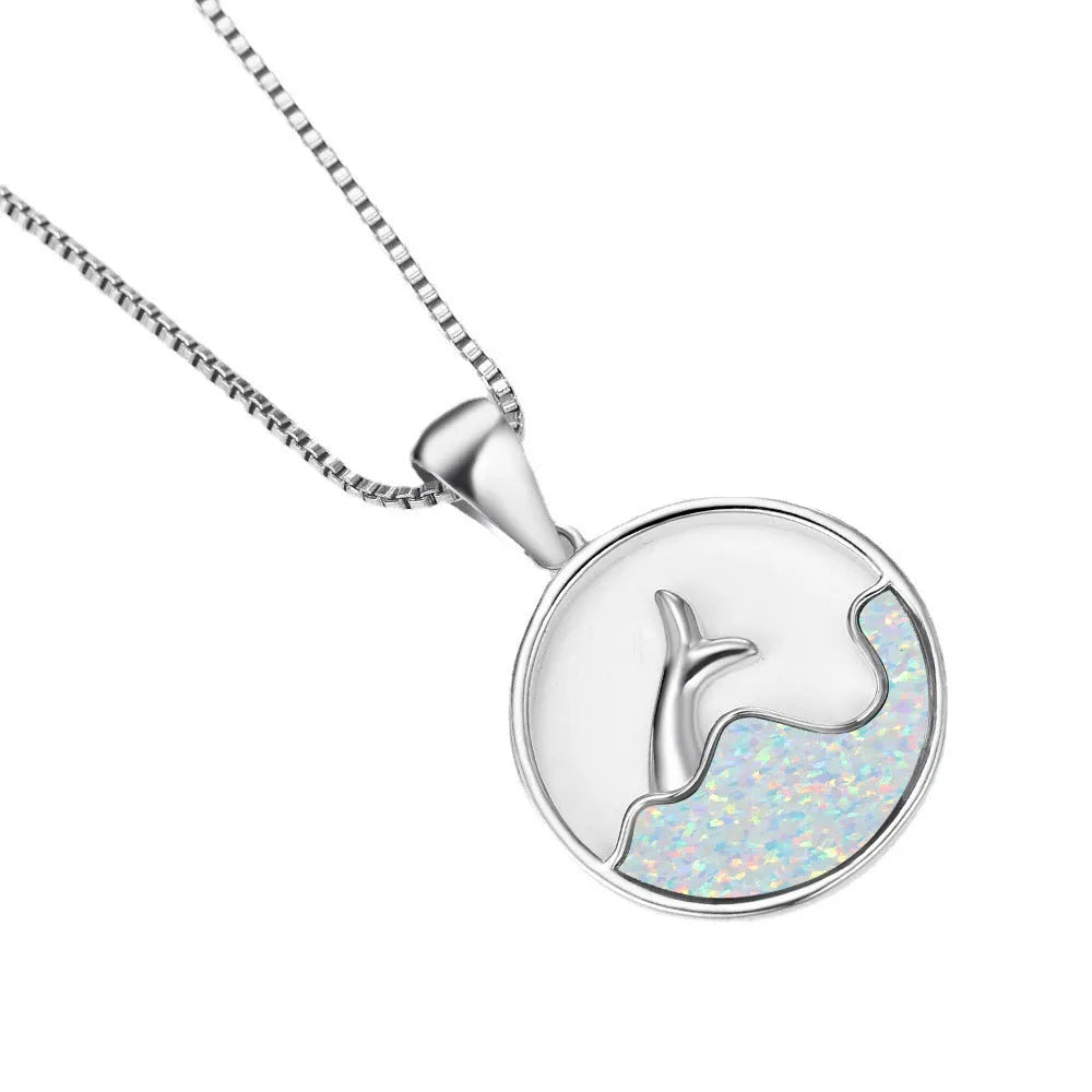 Geometric fishtail pendant necklace with a round blue opal stone on an adjustable silver-tone chain.