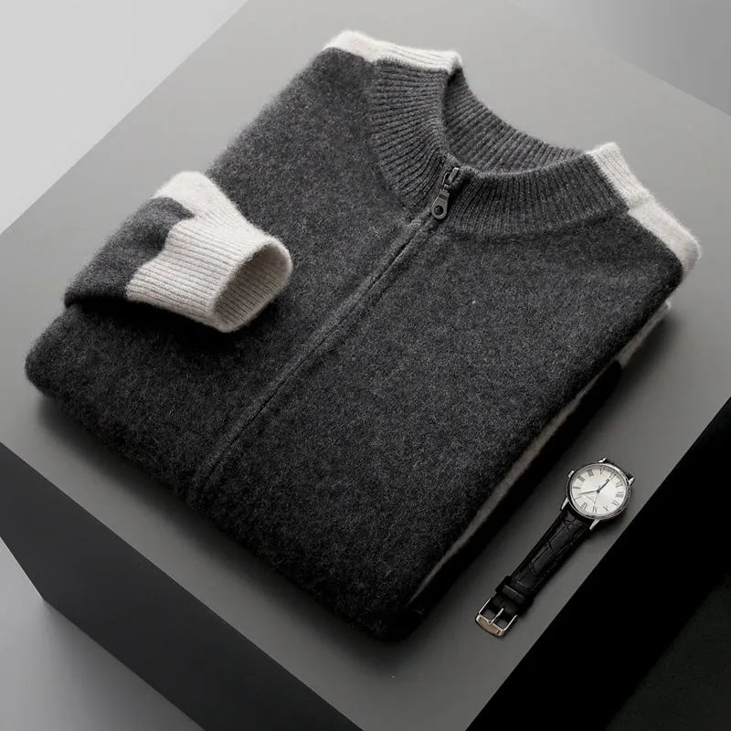Man wearing a dark blue half turtleneck zipper cardigan made of thick rough wool yarn.