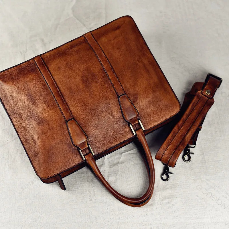 Men's brown leather business handbag with horizontal square shape and zipper opening