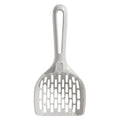 Grey plastic cat litter scoop with handle sitting upright in its integrated square base.