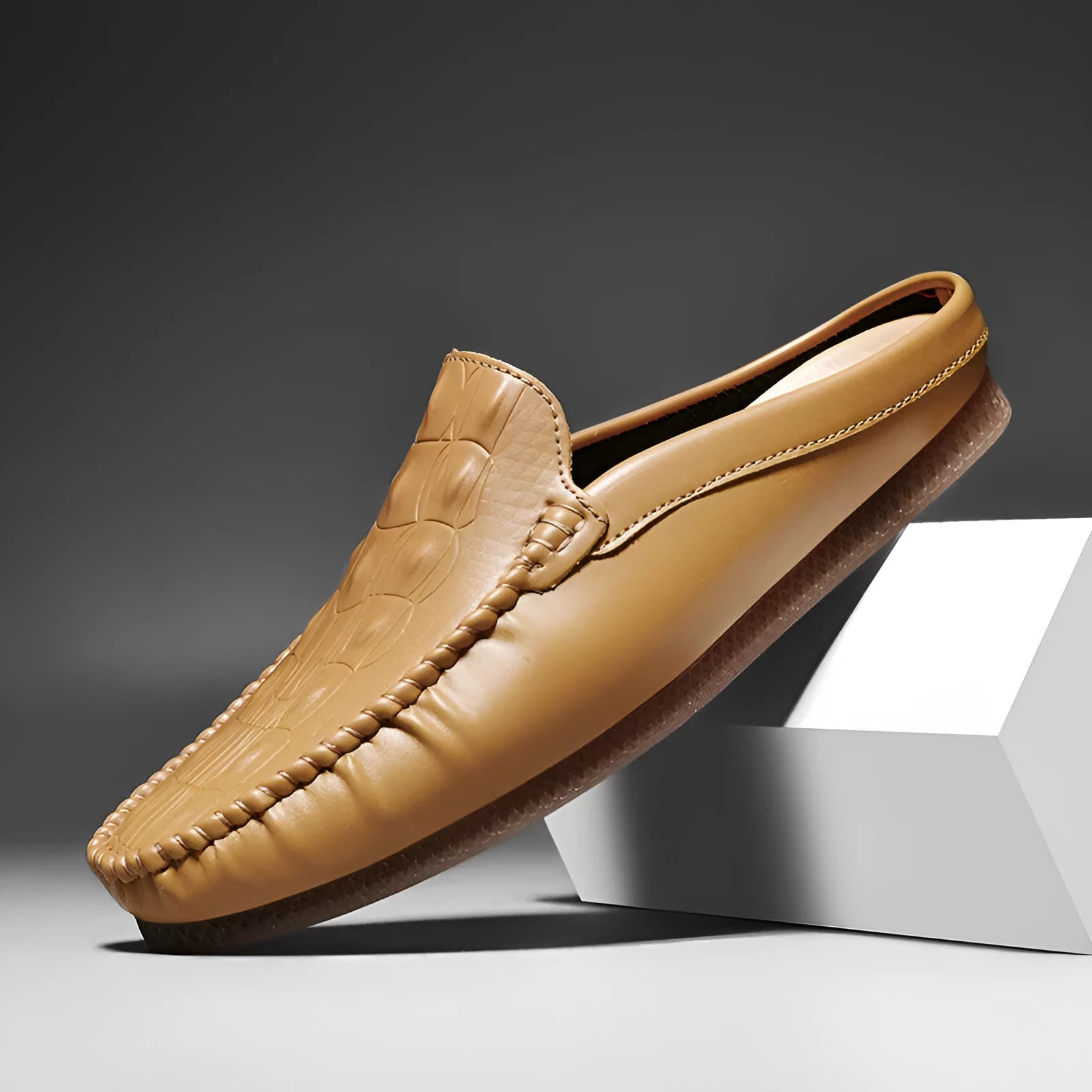 Men's black leisure semi-slipper with Gommino rubber sole and breathable artificial PU upper.