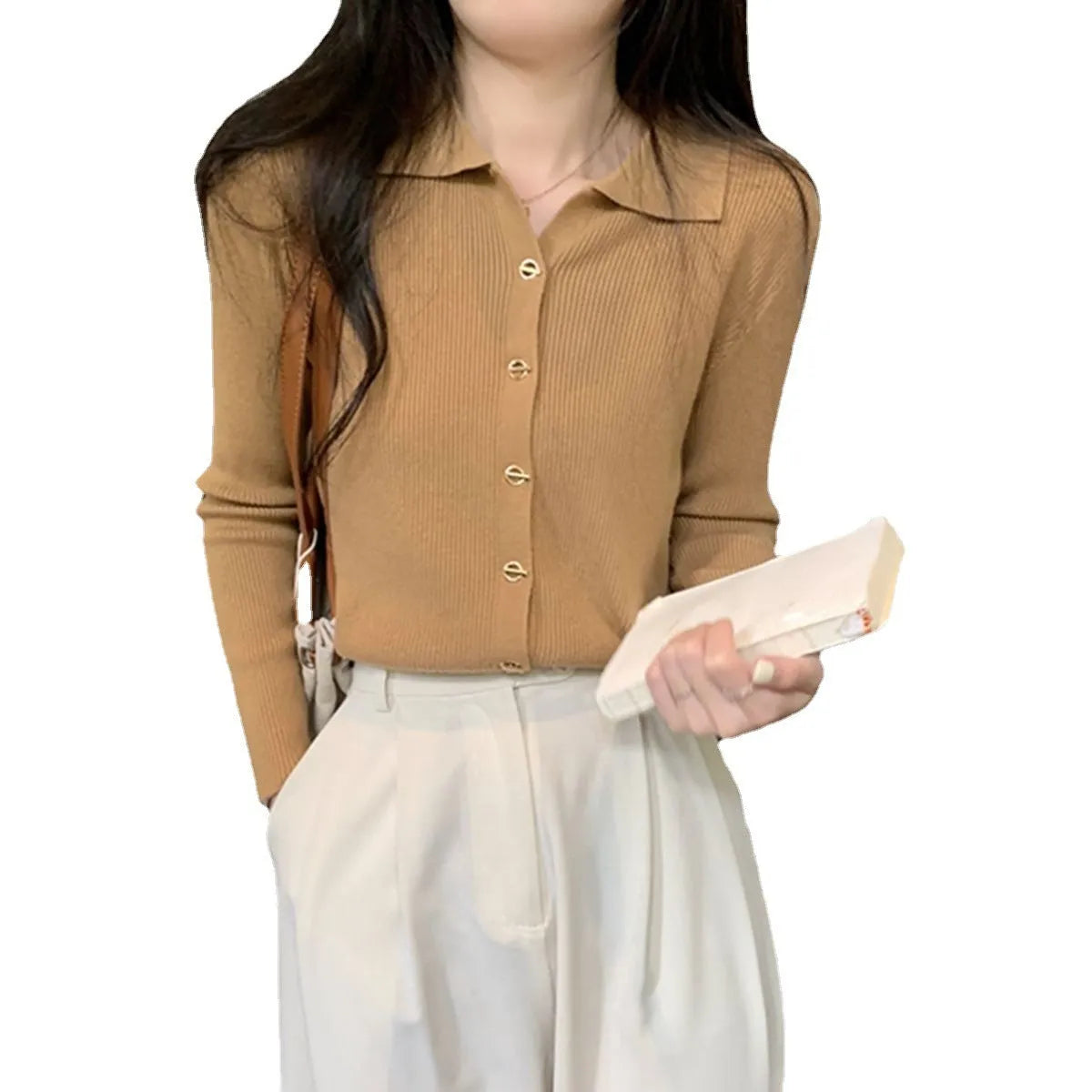 Loose fit beige viscose knitted cardigan with long sleeves, shown worn open.