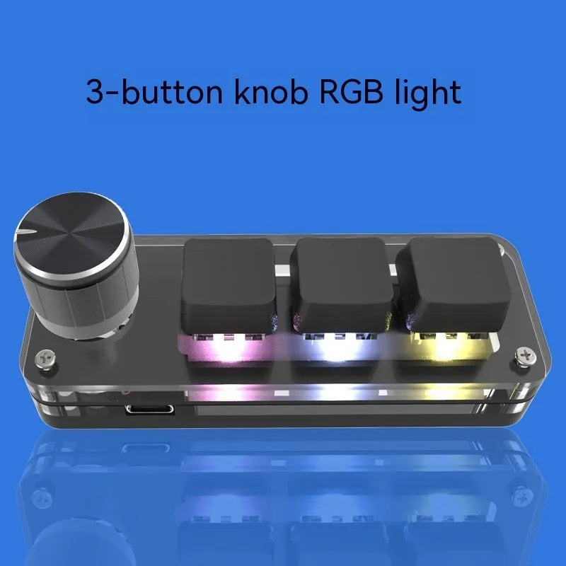 Black custom mechanical keypad with RGB backlighting and dedicated copy paste keys on desk