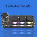 Black custom mechanical keypad with RGB backlighting and dedicated copy paste keys on desk