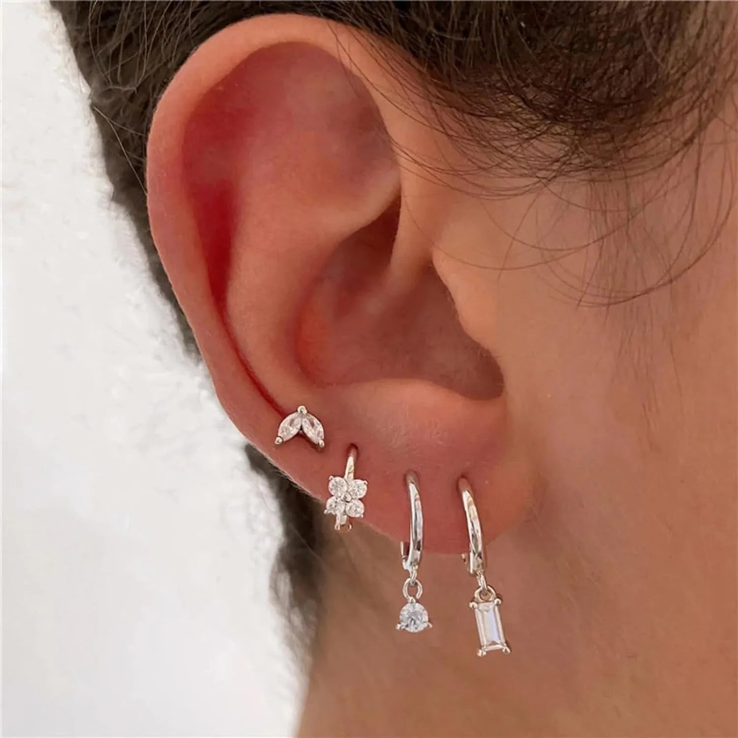 Geometric square zircon copper earrings for women in four-piece set with gold electroplated finish showing star and quadrilateral designs
