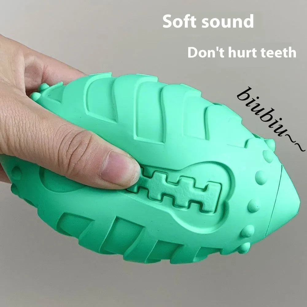 Bite-resistant rubber dog training ball in rugby shape, light green colour, for aggressive chewers